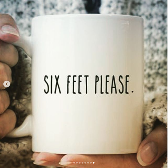 a mug reads six feet please